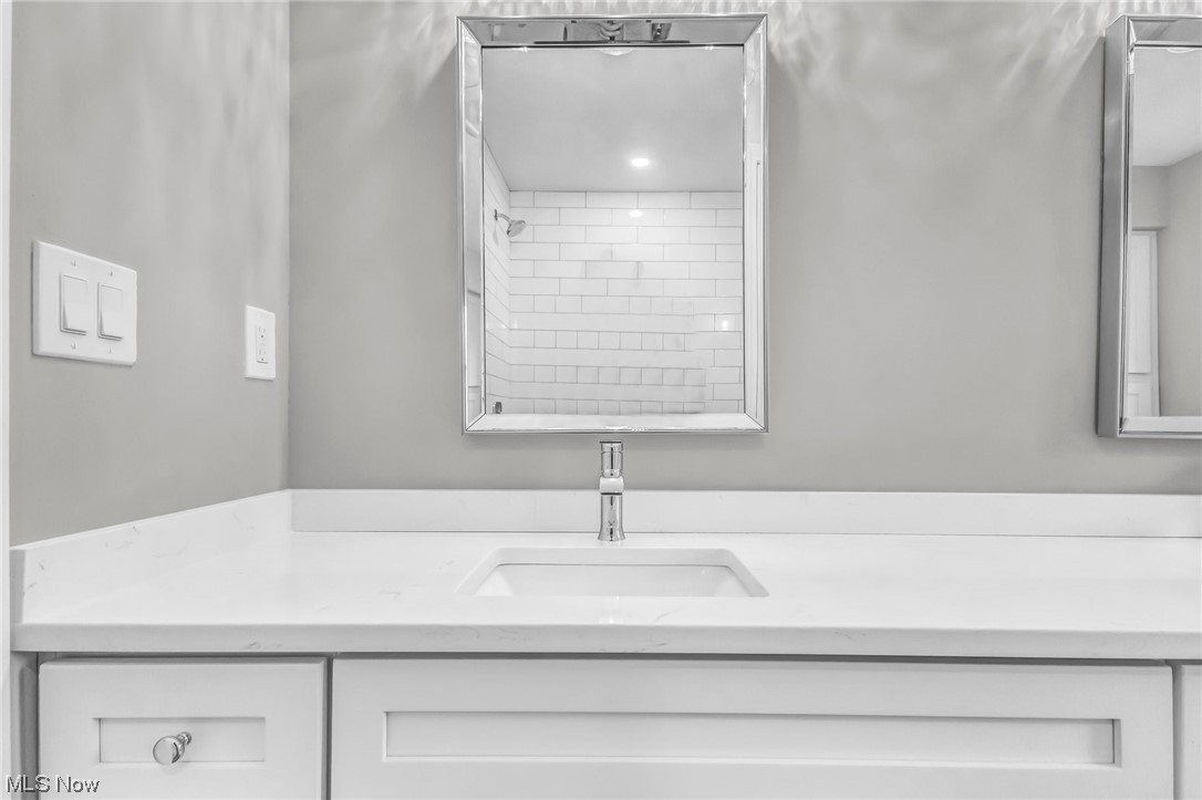 18230 Egbert Road Walton Hills, OH 44146 - Photo 18 of 34 Main Bathroom featuring new double sink vanity with a quartz top.