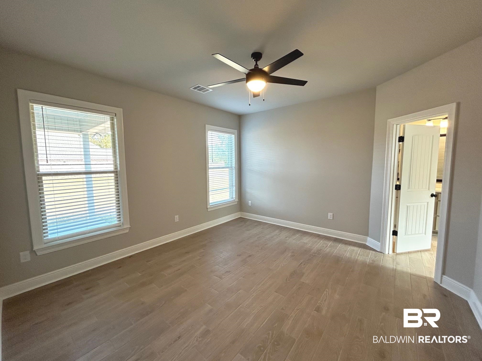 808 Sumter Loop Foley, AL 36535 - Photo 7 of 18 Spare room with hardwood / wood-style floors and ceiling fan