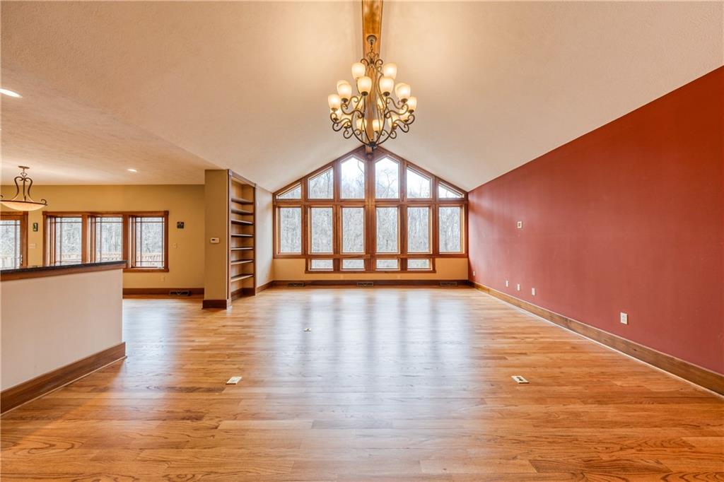 2353 Nicholson Road Sewickley, PA 15143 - Photo 17 of 50 The Great room highlights a wall of windows capturing private wooded views.