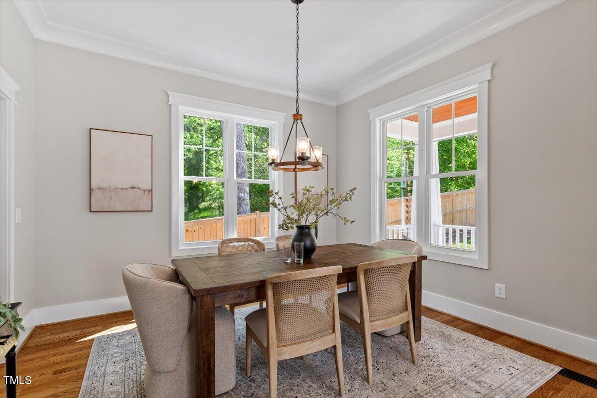 3932 Old Chapel Hill Road Durham, NC 27707 - Photo 14 of 46 a dining room with furniture window wooden floor