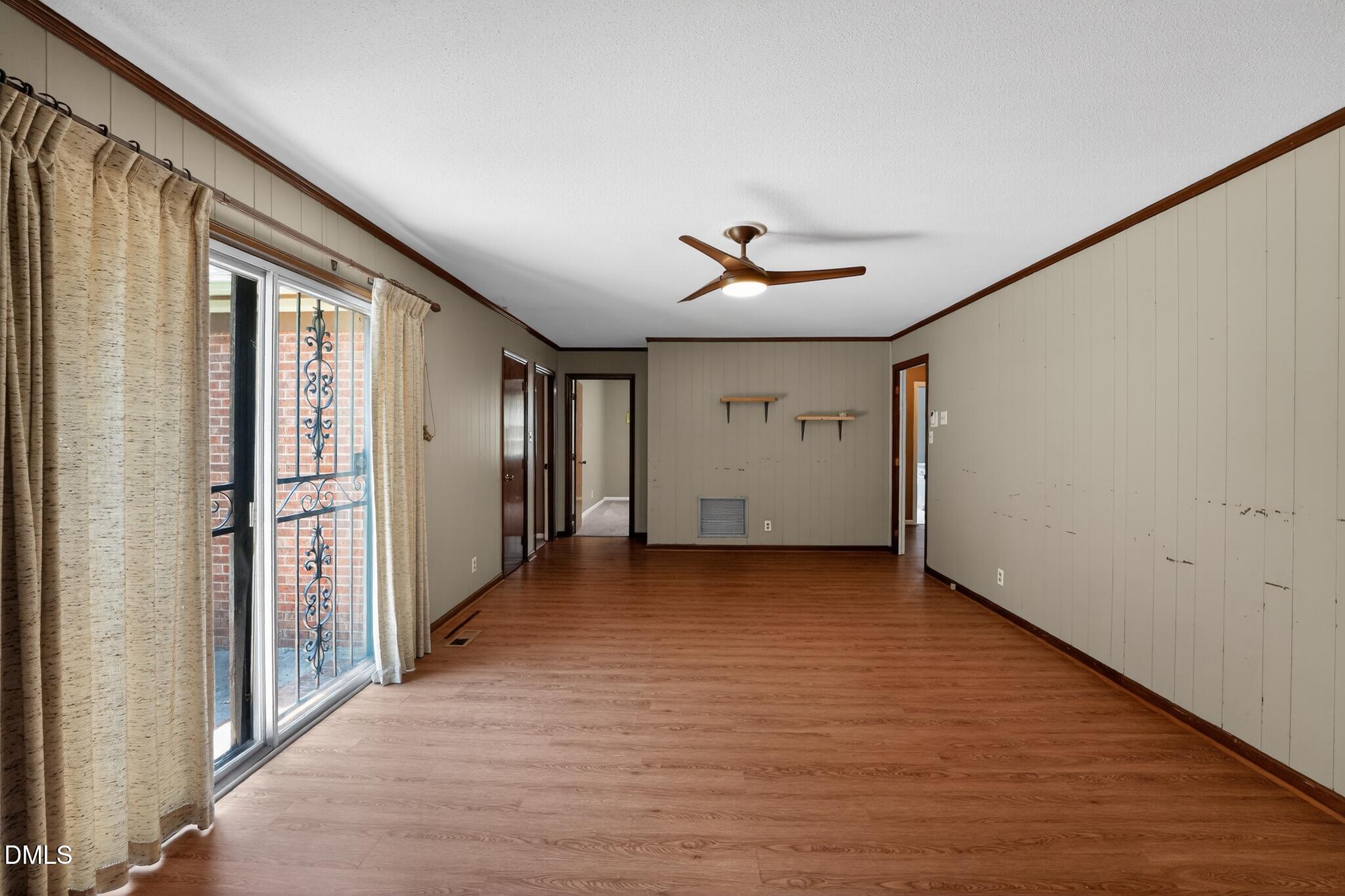 1034 Jerome Road Durham, NC 27713 - Photo 9 of 35 a view of a livingroom with wooden floor and window