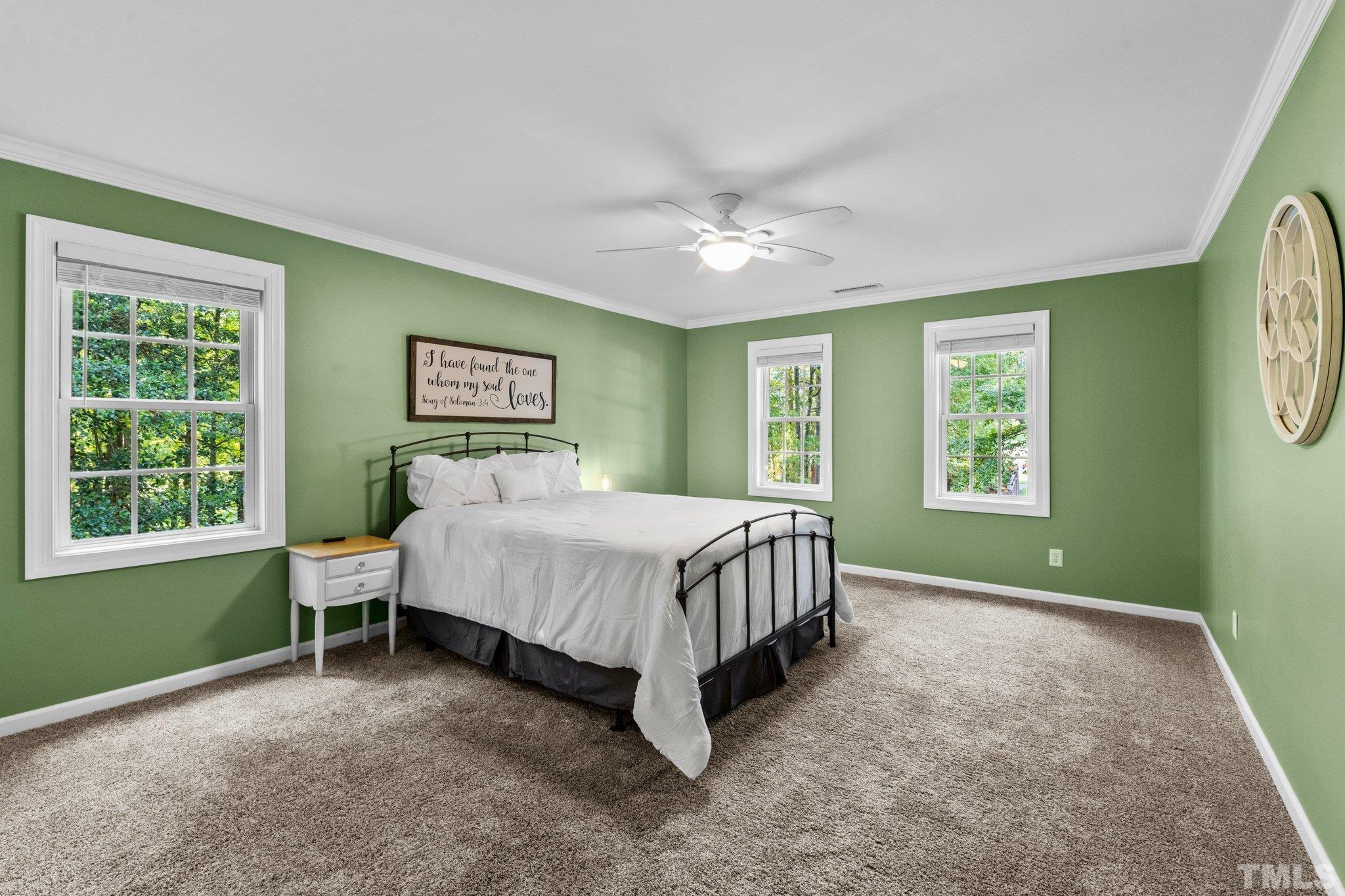 6304 Meerbrook Court Raleigh, NC 27603 - Photo 11 of 30 a spacious bedroom with a bed and a window