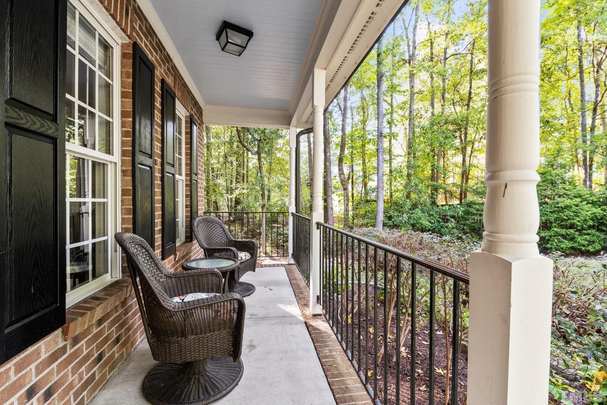 6304 Meerbrook Court Raleigh, NC 27603 - Photo 27 of 30 a balcony with furniture and floor to ceiling windows
