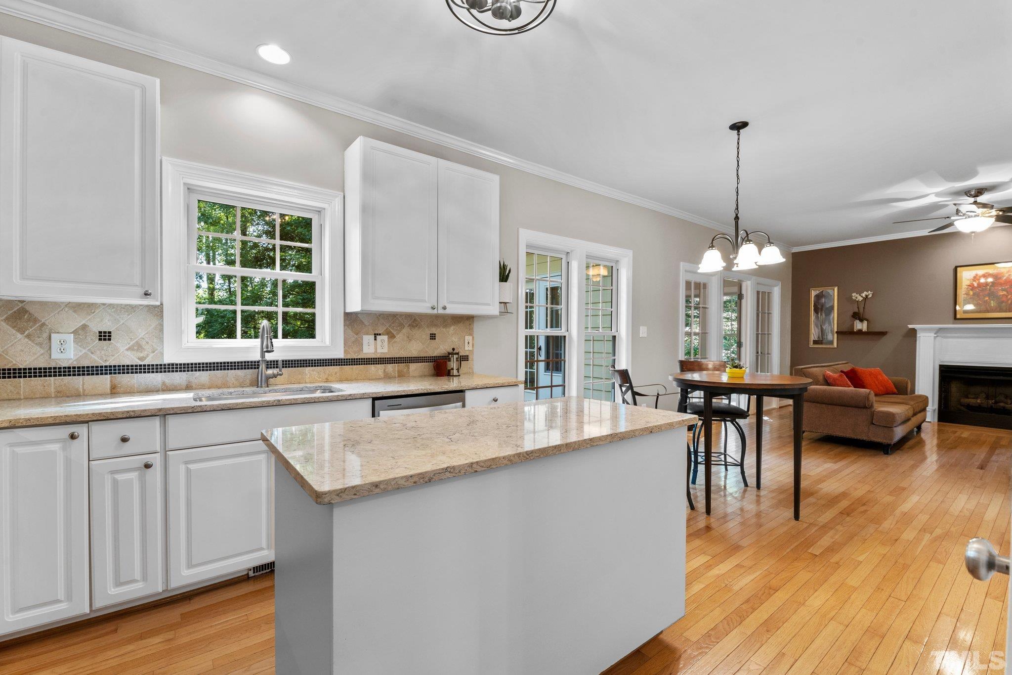6304 Meerbrook Court Raleigh, NC 27603 - Photo 5 of 30 a large kitchen with a large island in it