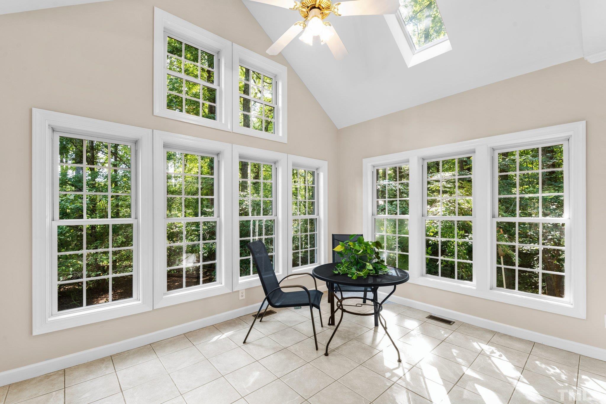 6304 Meerbrook Court Raleigh, NC 27603 - Photo 10 of 30 a view of a chair and table in a room with a window