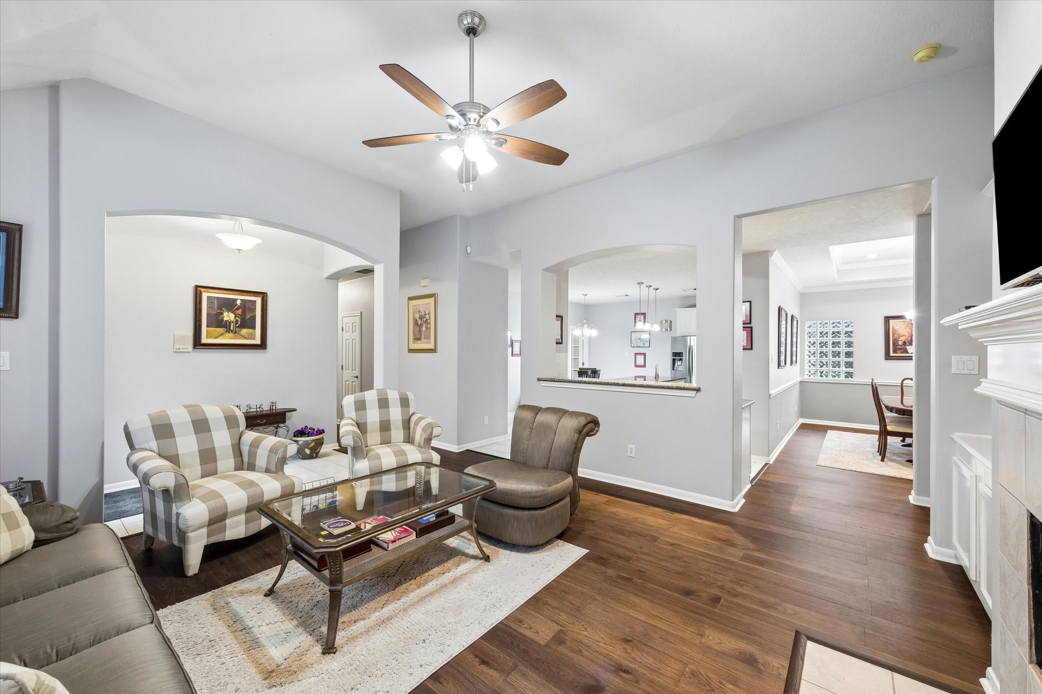 12423 Rutgers Park Court Houston, TX 77058 - Photo 6 of 29 a living room with furniture and a chandelier