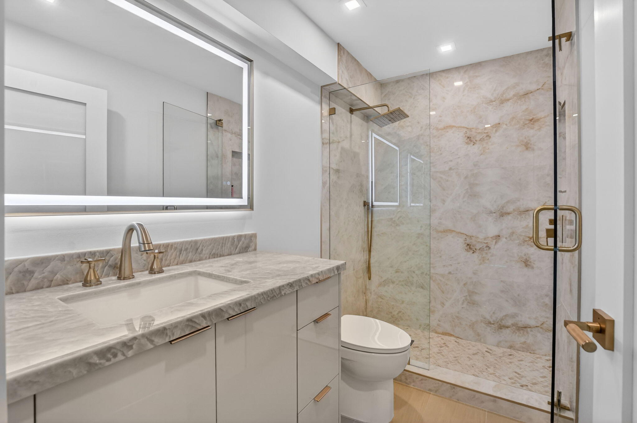 2800 South Ocean Boulevard, Unit 23C Boca Raton, FL 33432 - Photo 33 of 50 a bathroom with a granite countertop sink toilet and shower