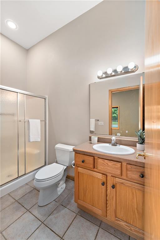 49 Babcock Road Mercer, PA 16137 - Photo 21 of 49 a bathroom with a toilet a sink and mirror