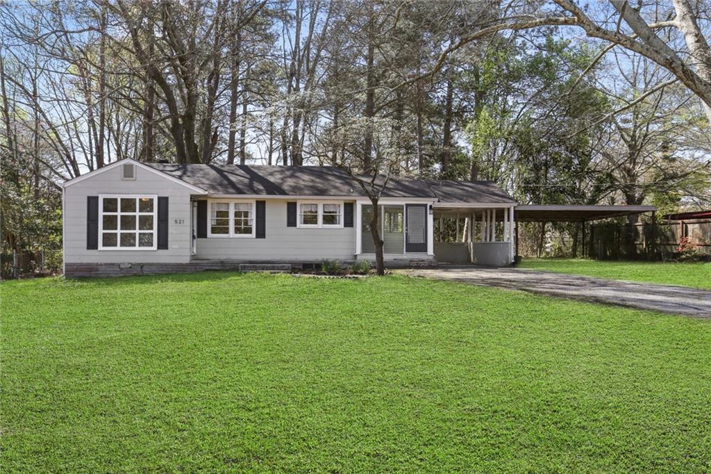 521 Ridge Avenue Mableton, GA 30126 - Photo 1 of 1 a front view of a house with a garden