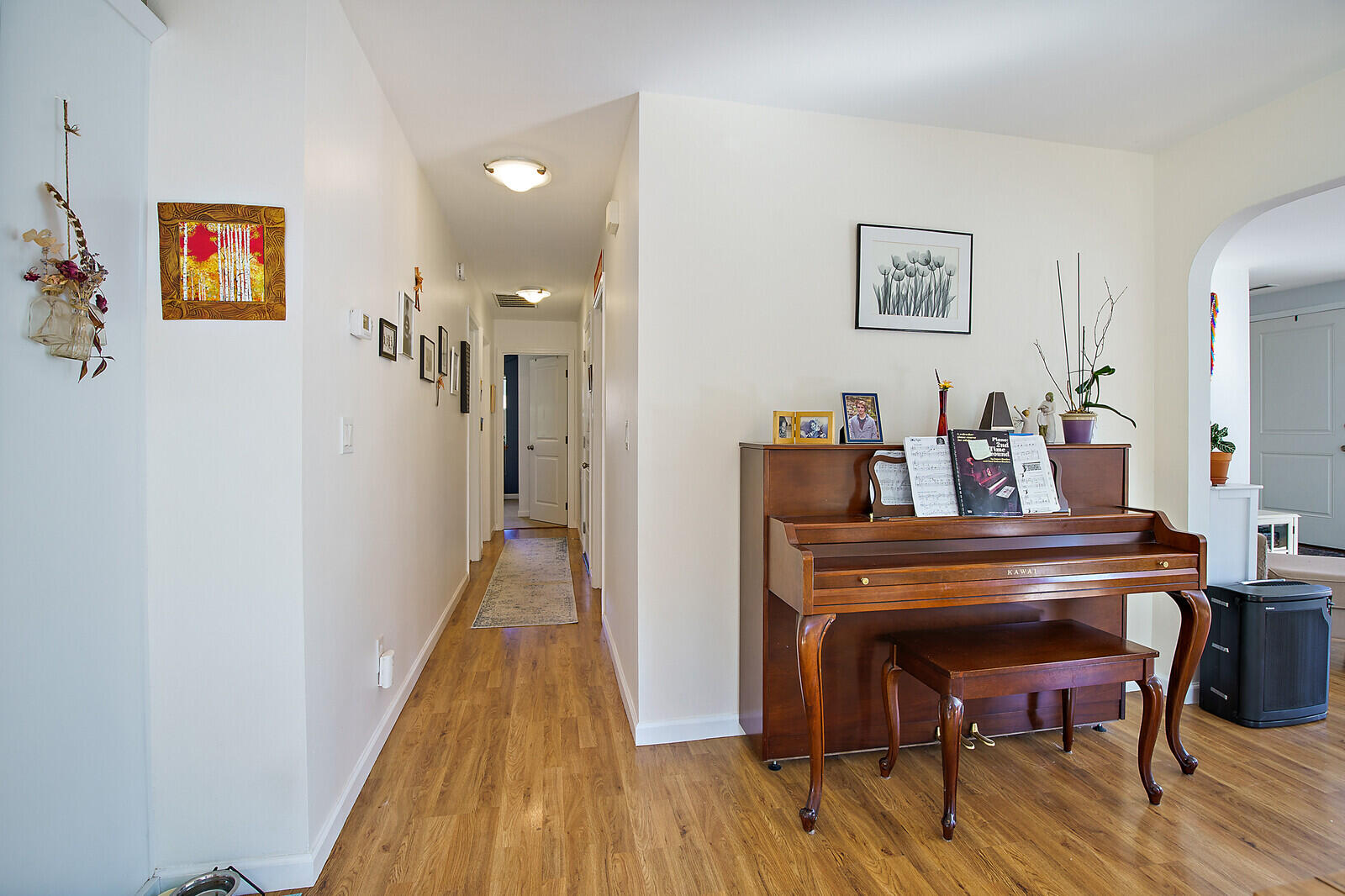 1399 Mill Pond Road Ashland, OR 97520 - Photo 14 of 28 a view of a hallway with wooden floor and furniture