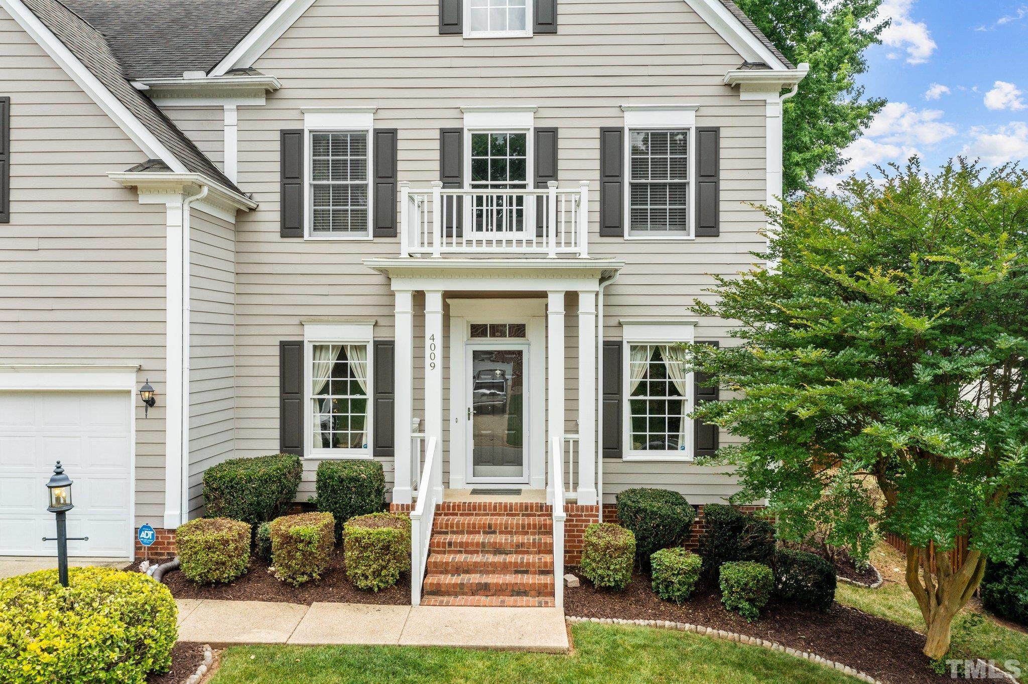 4009 Sunridge Road Raleigh, NC 27613 - Photo 4 of 35 a front view of a house with garden