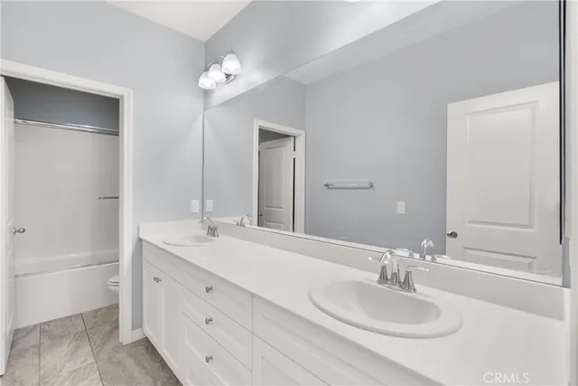 a bathroom with a shower and a bath tub