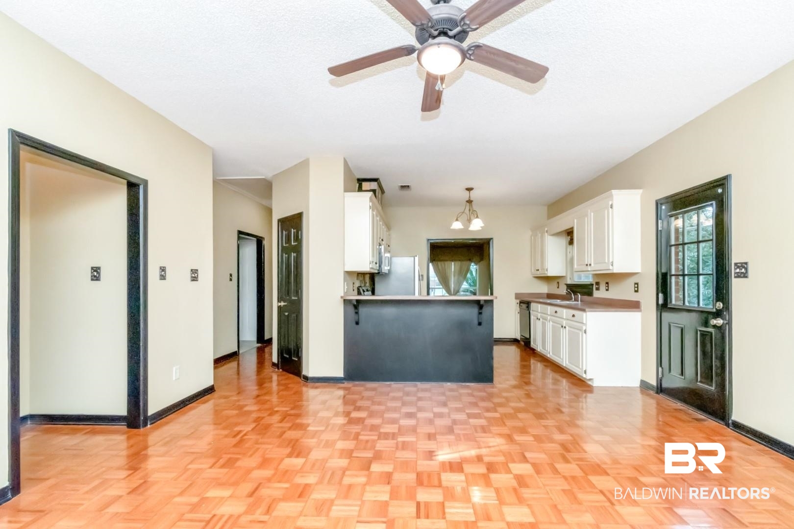 152 Ideal Avenue Mobile, AL 36608 - Photo 18 of 32 Kitchen with stainless steel appliances, white cabinetry, light parquet flooring, and pendant lighting