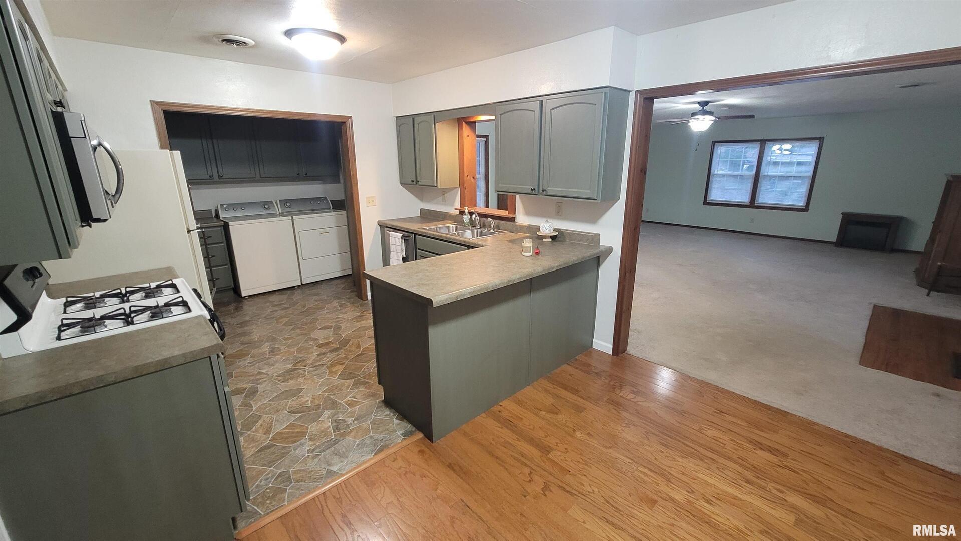 2633 South Broadway Salem, IL 62881 - Photo 28 of 39 a kitchen with stainless steel appliances granite countertop a sink stove and refrigerator