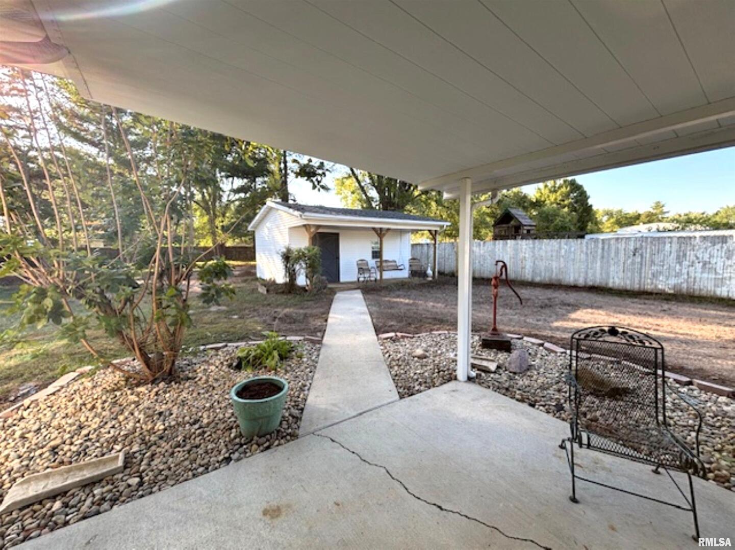 2633 South Broadway Salem, IL 62881 - Photo 6 of 39 a view of a patio with table and chairs potted plants with wooden floor and seating space