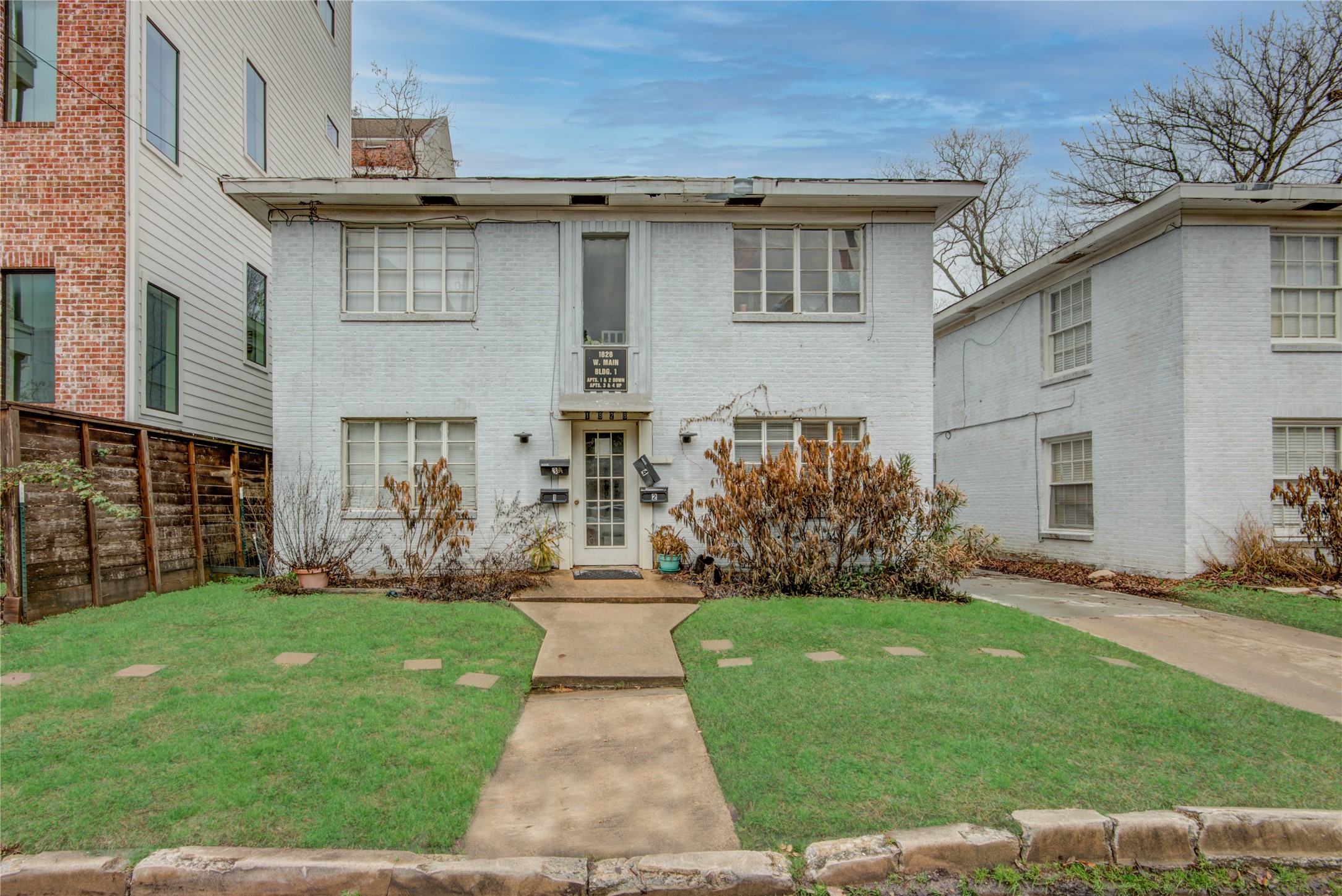 1828 West Main Street, Unit 1 Houston, TX 77098 - Photo 3 of 20 a front view of a house with a yard