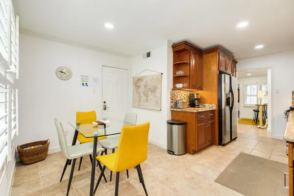 a view of kitchen with furniture and wooden floor