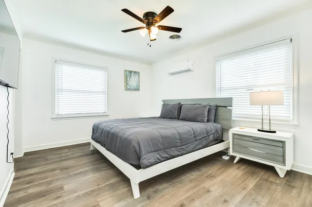 a spacious bedroom with a bed and window