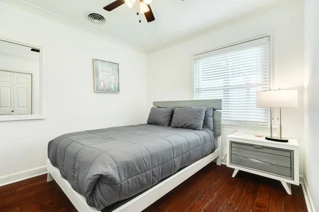 a bed room with a bed and a night stand