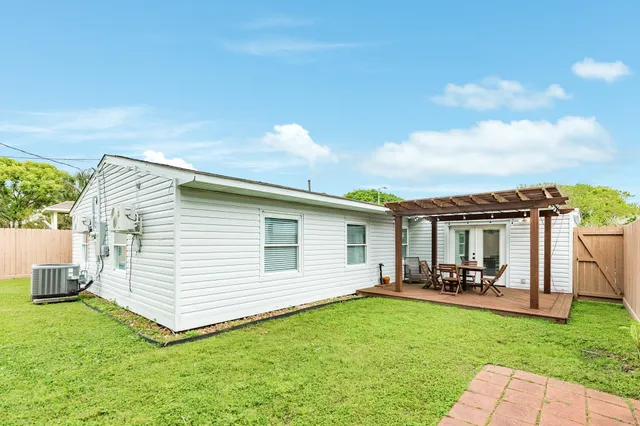 a view of a backyard with furniture