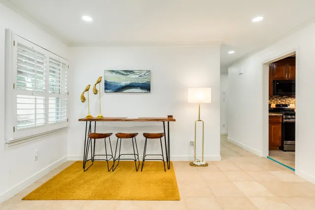 a view of a room with furniture and window
