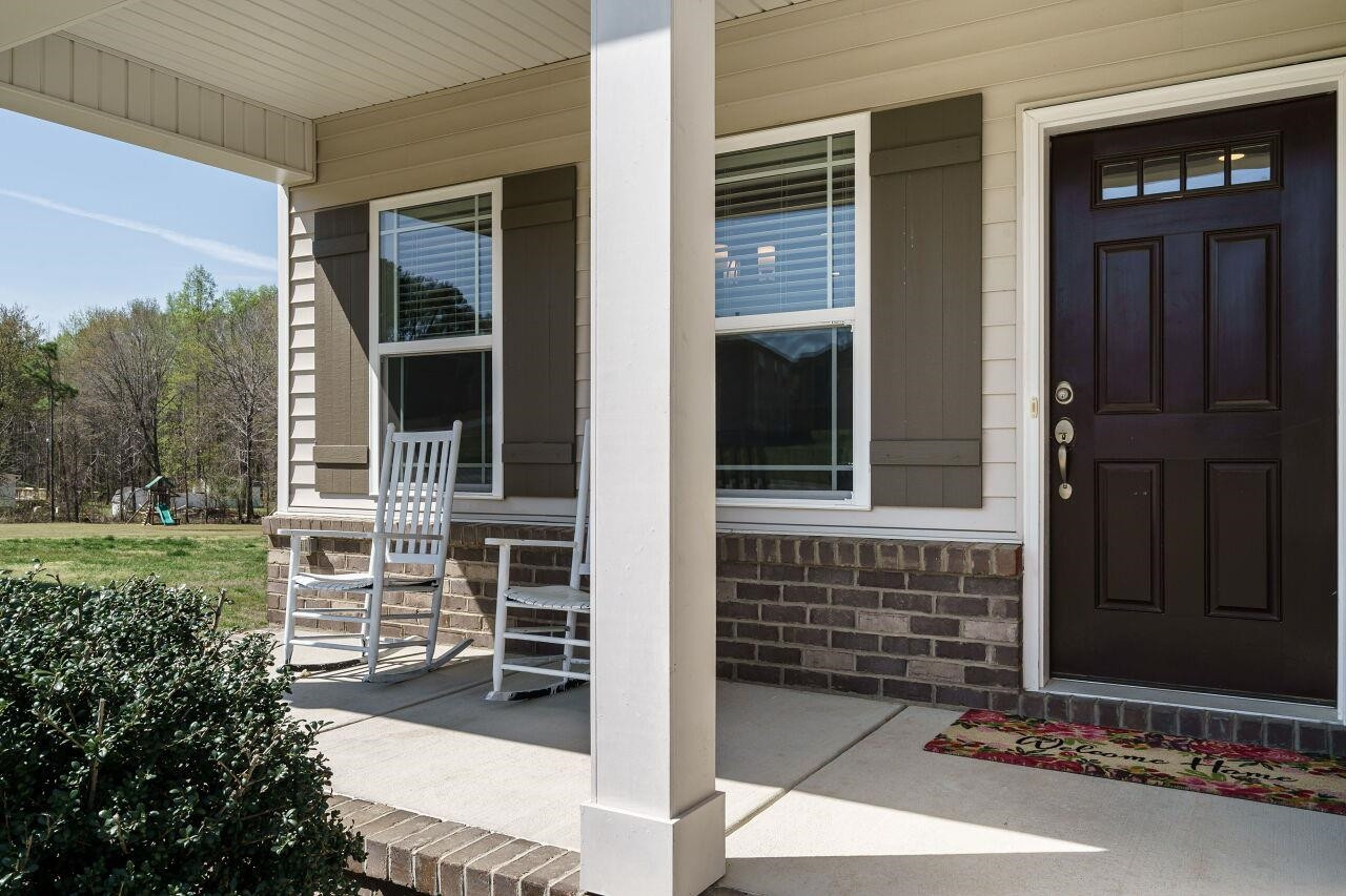 1509 Yakimas Road Raleigh, NC 27603 - Photo 2 of 38 Bring your rocking chairs and enjoy spending time outside. Covered Porch