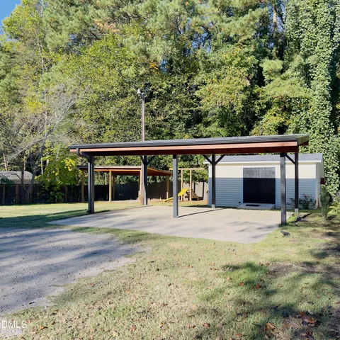 a front view of a house with swimming pool having outdoor seating