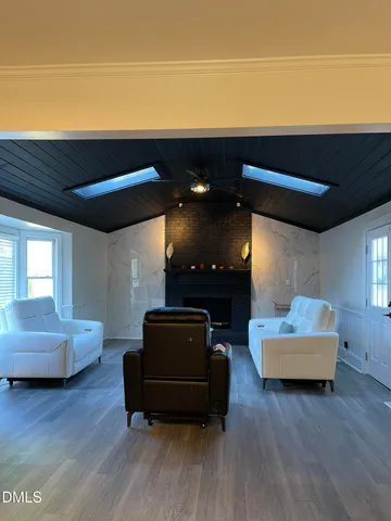 a kitchen with sink a microwave and cabinets