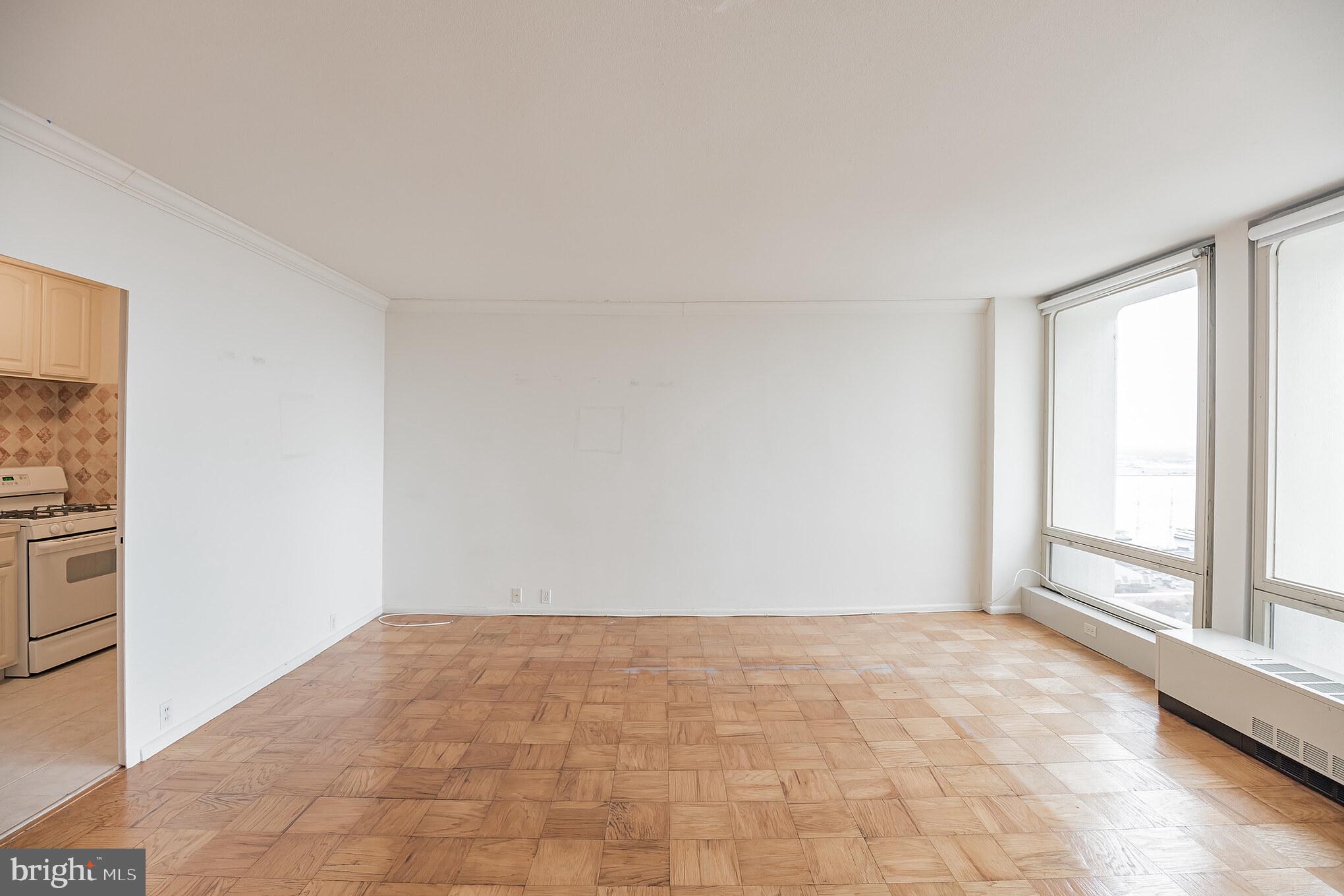 200 Locust Street, Unit 25H Philadelphia, PA 19106 - Photo 17 of 30 living room (kitchen on left)