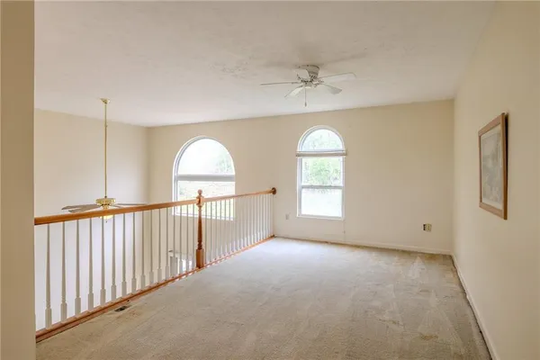 a view of empty room with windows
