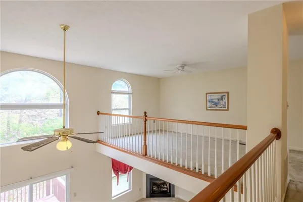a view of an entryway wooden floor and a window