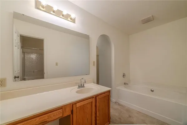a bathroom with a sink and a bathtub