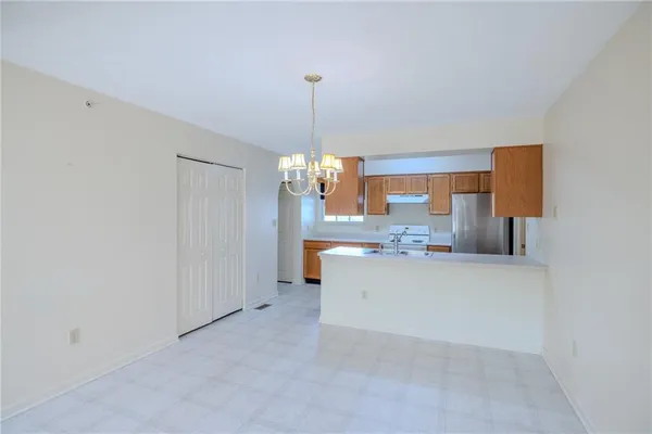 a view of a kitchen and chandelier