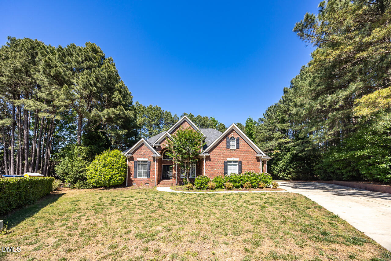 4004 Frontenac Court Apex, NC 27539 - Photo 2 of 61 a front view of a house with a yard and garage