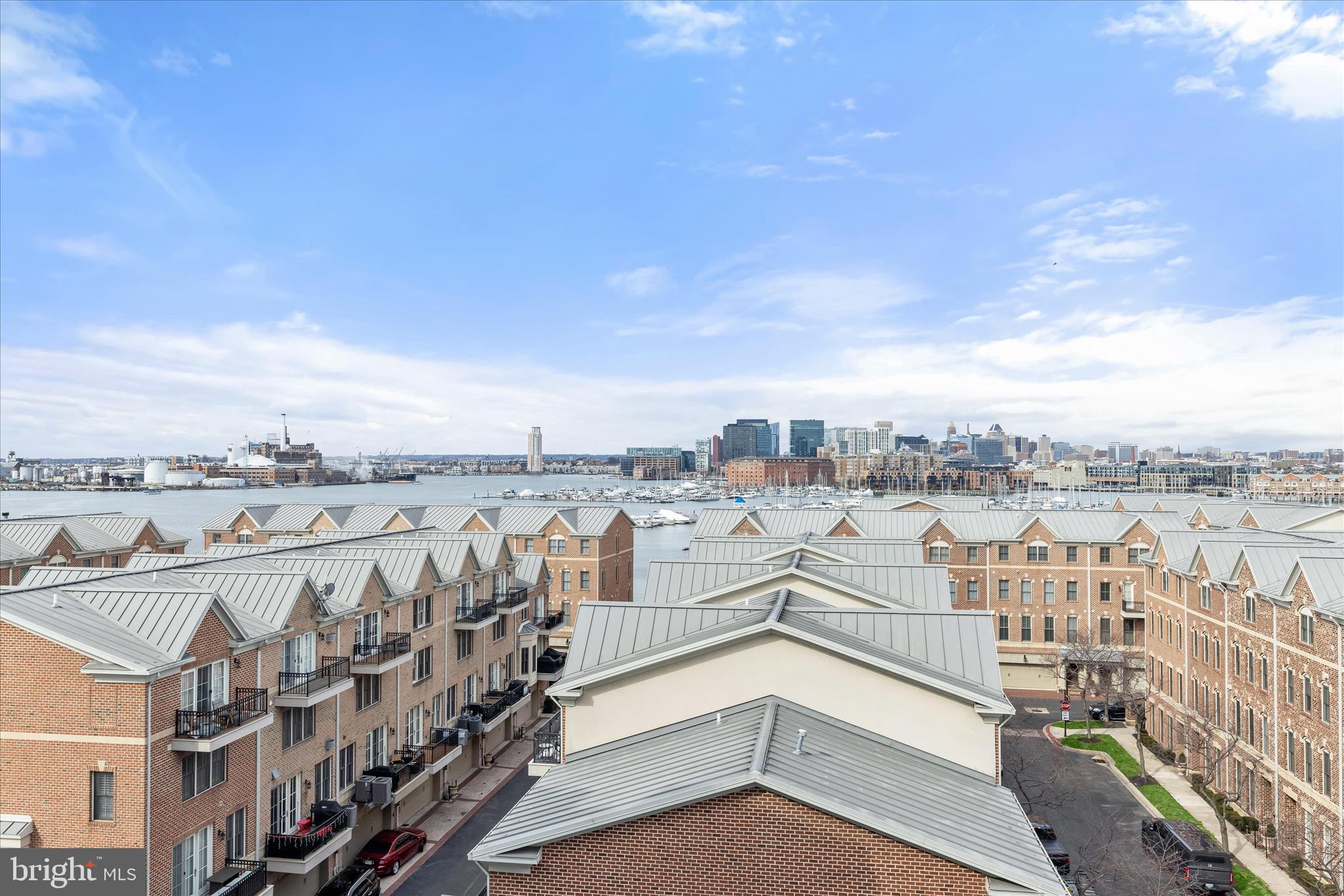 2702 Lighthouse Point East, Unit 522 Baltimore, MD 21224 - Photo 33 of 50 a view of a terrace with lawn chairs