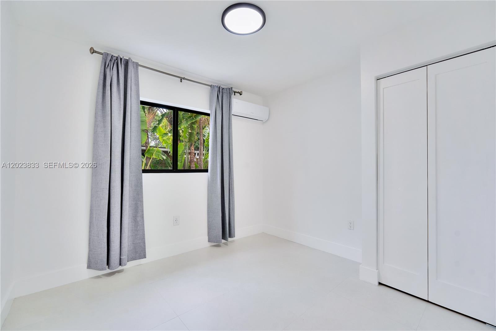 6566 Southwest 35th Street Miami, FL 33155 - Photo 20 of 36 an empty room with windows