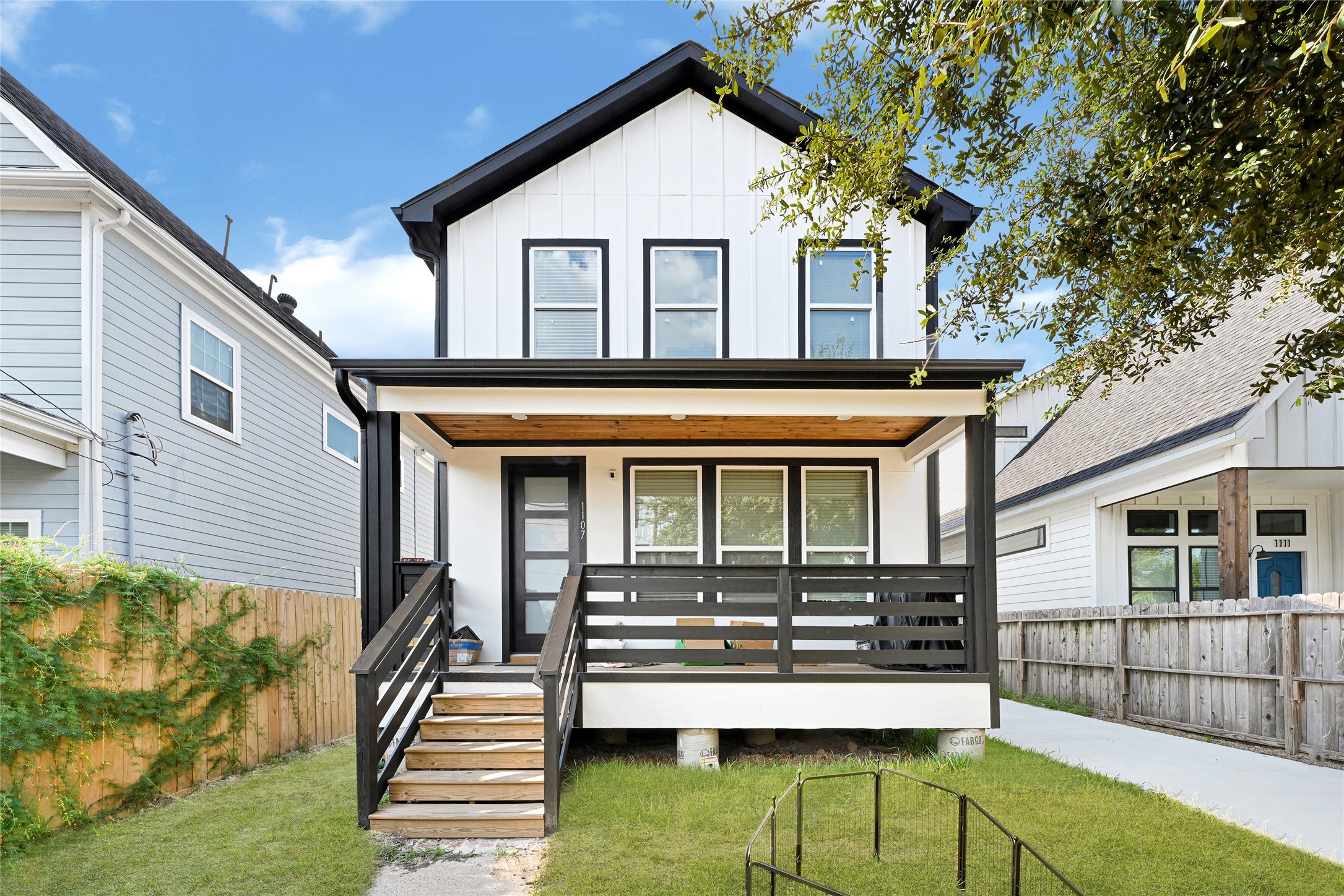 1107 Brooks Street Houston, TX 77009 - Photo 1 of 30 front view of house with a yard