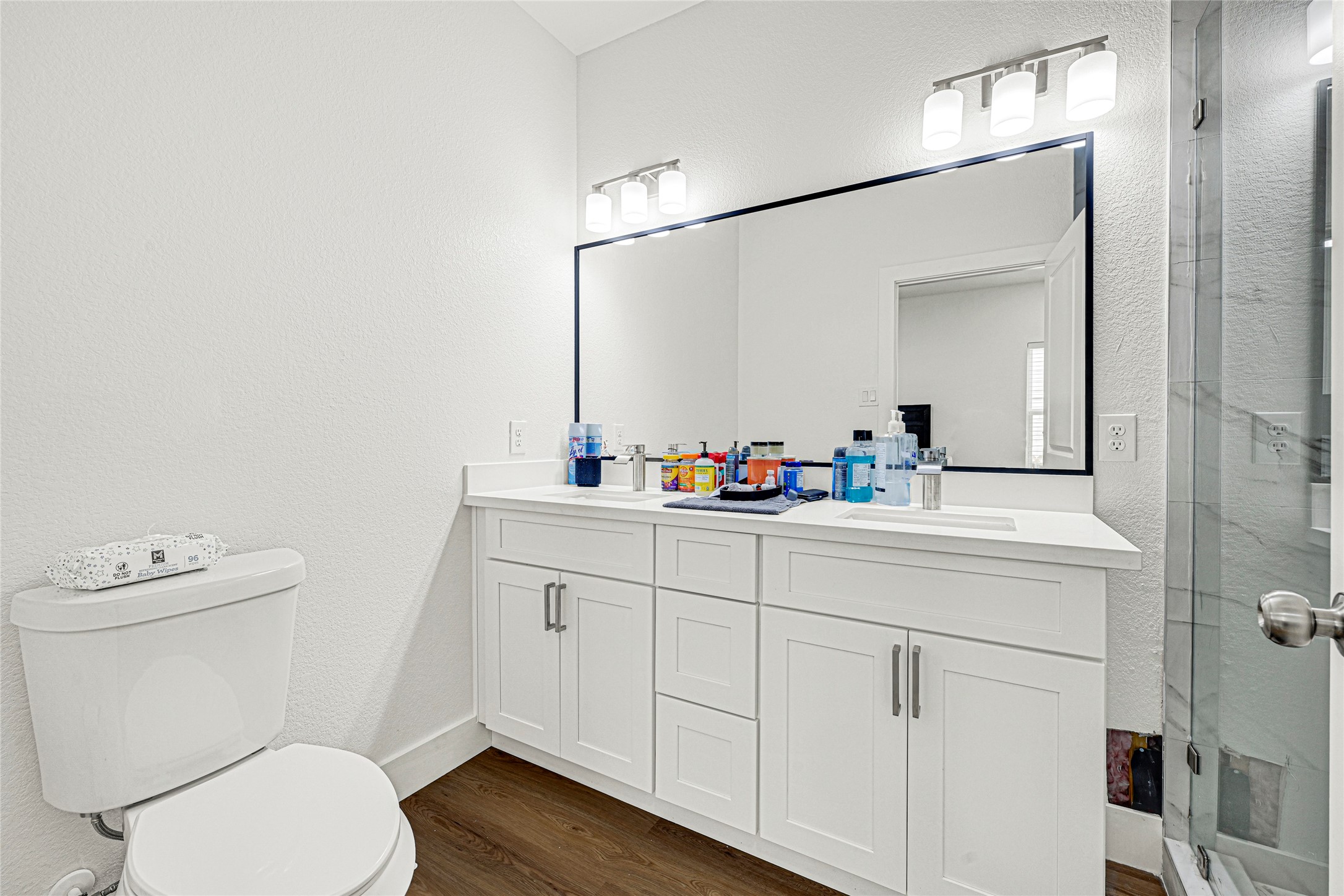1107 Brooks Street Houston, TX 77009 - Photo 13 of 30 a bathroom with a sink vanity mirror and toilet