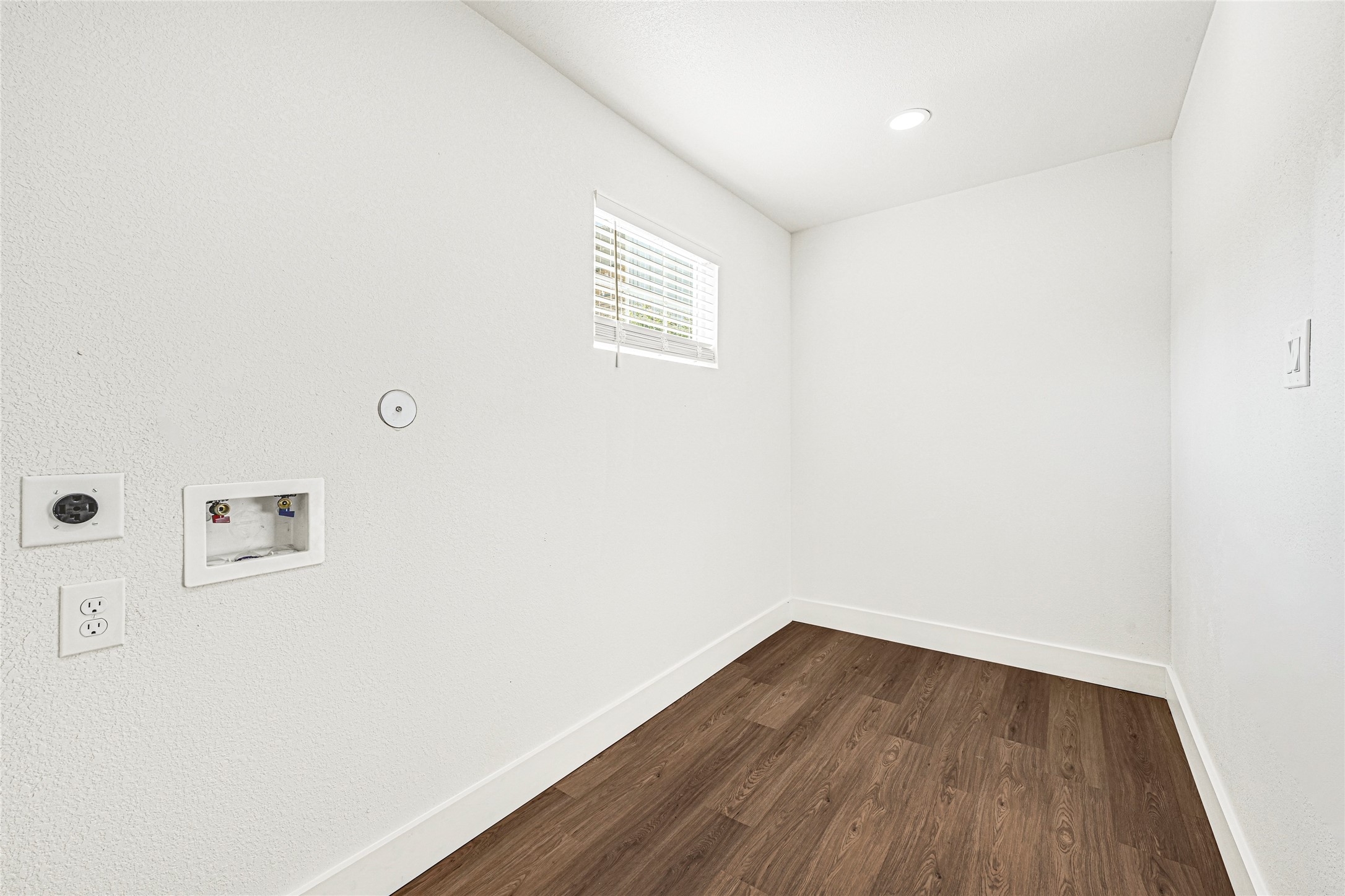 1107 Brooks Street Houston, TX 77009 - Photo 26 of 30 a view of a room with wooden floor and white walls