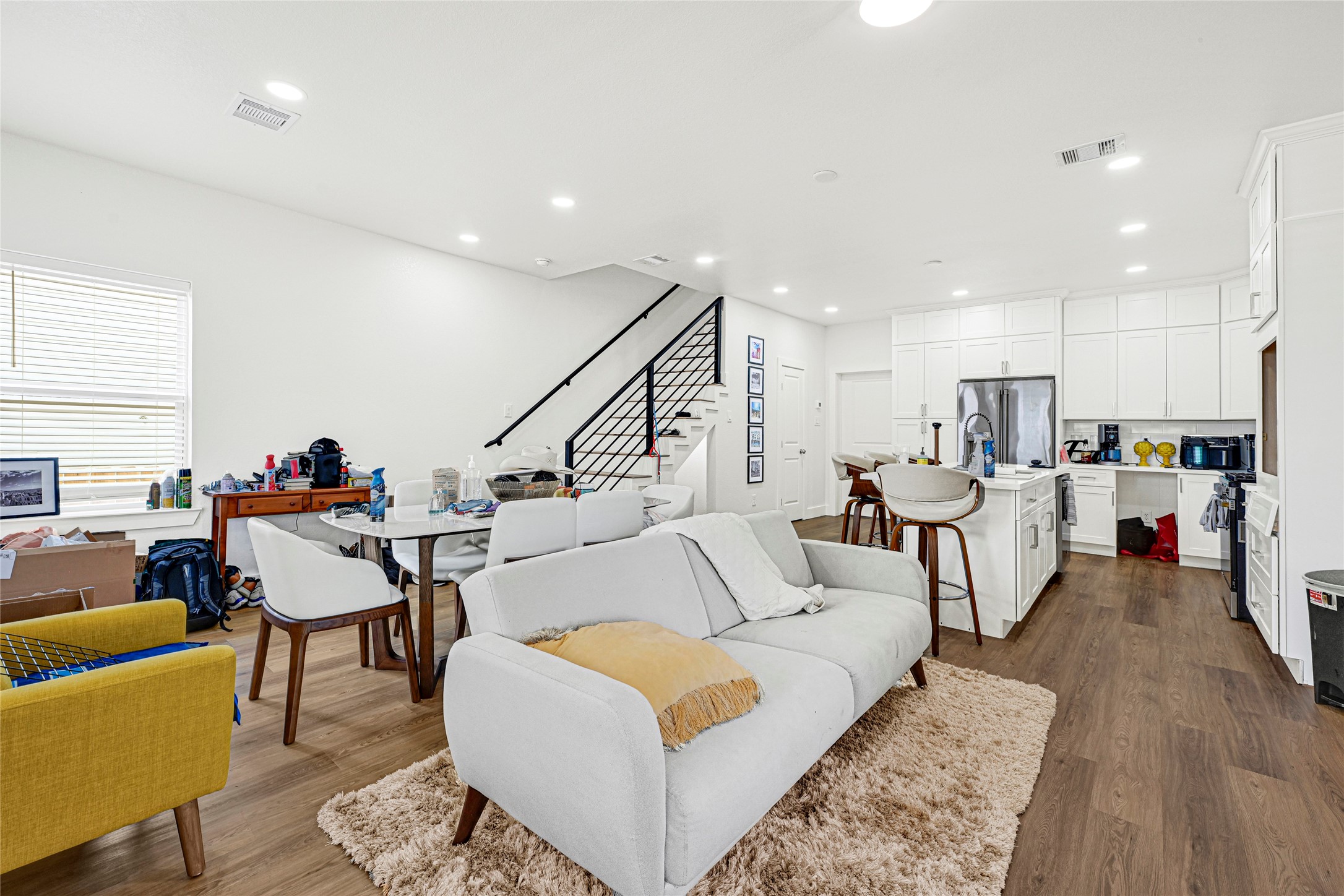 1107 Brooks Street Houston, TX 77009 - Photo 6 of 30 a living room with furniture and kitchen view