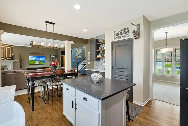 a kitchen with counter space and dining table