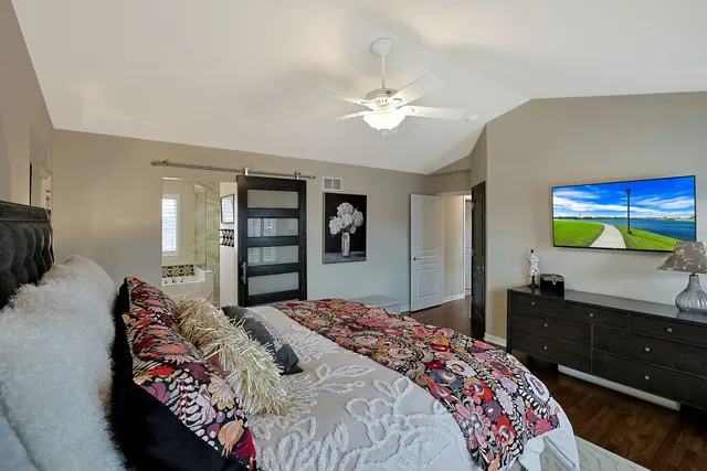 a bedroom with a bed and a dresser