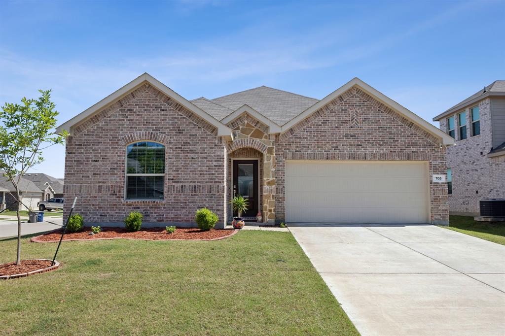 705 Alden Drive Princeton, TX 75407 - Photo 1 of 26 a front view of a house with a yard and potted plants
