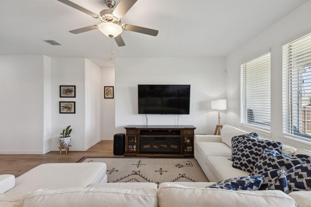 705 Alden Drive Princeton, TX 75407 - Photo 6 of 26 a living room with furniture or couch and a flat screen tv