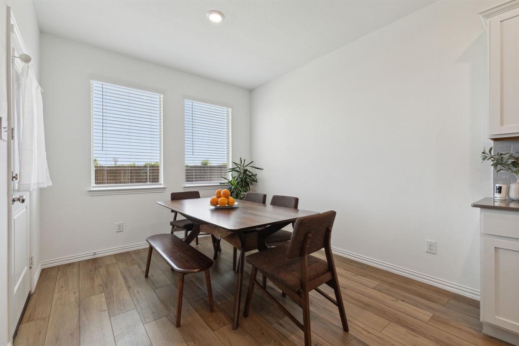 705 Alden Drive Princeton, TX 75407 - Photo 7 of 26 a view of a workspace with furniture and wooden floor