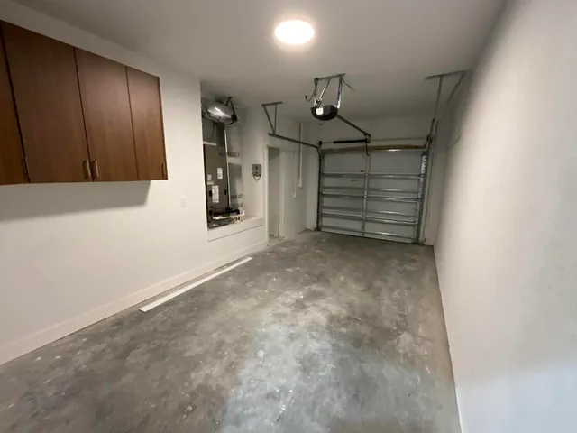 a view of an empty room and a window