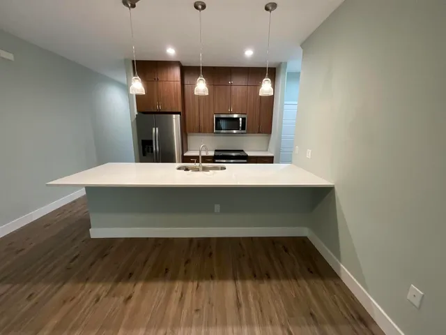 a view of kitchen with wooden floor