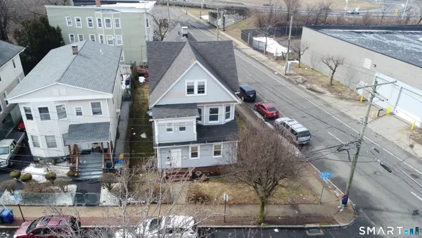 a view of multiple houses with a street
