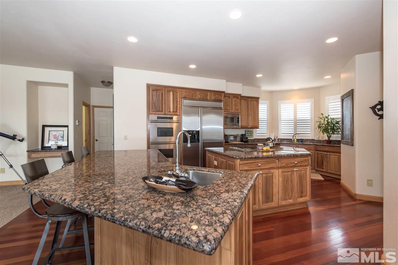 1199 Yates Lane Reno, NV 89509 - Photo 9 of 25 a kitchen with a counter top appliances and cabinets