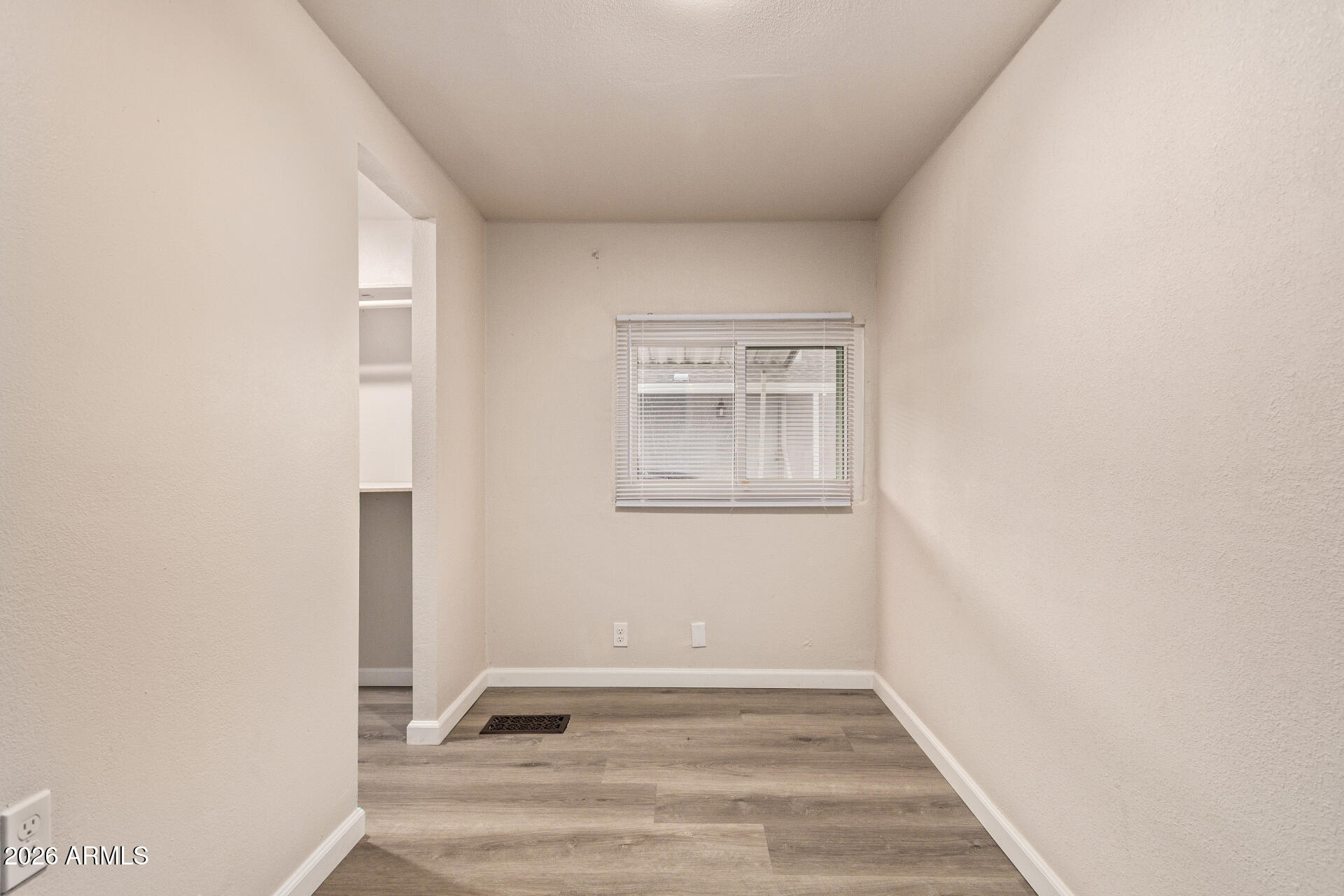 400 West Baseline Road, Unit 312 Tempe, AZ 85283 - Photo 19 of 32 a view of an empty room with wooden floor